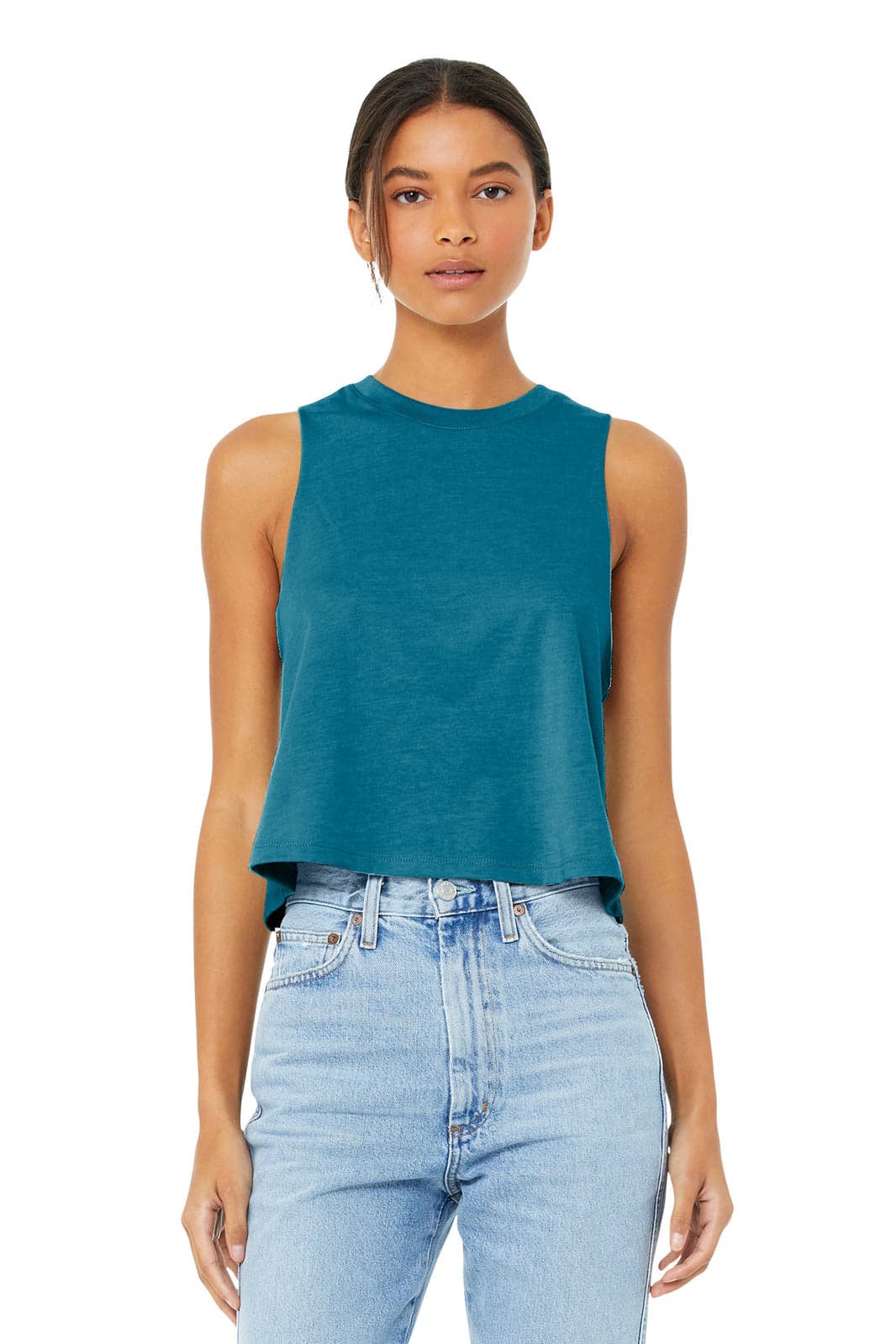 A teal cropped tank top with a racerback design, worn by a model paired with blue jeans. It features a logo.