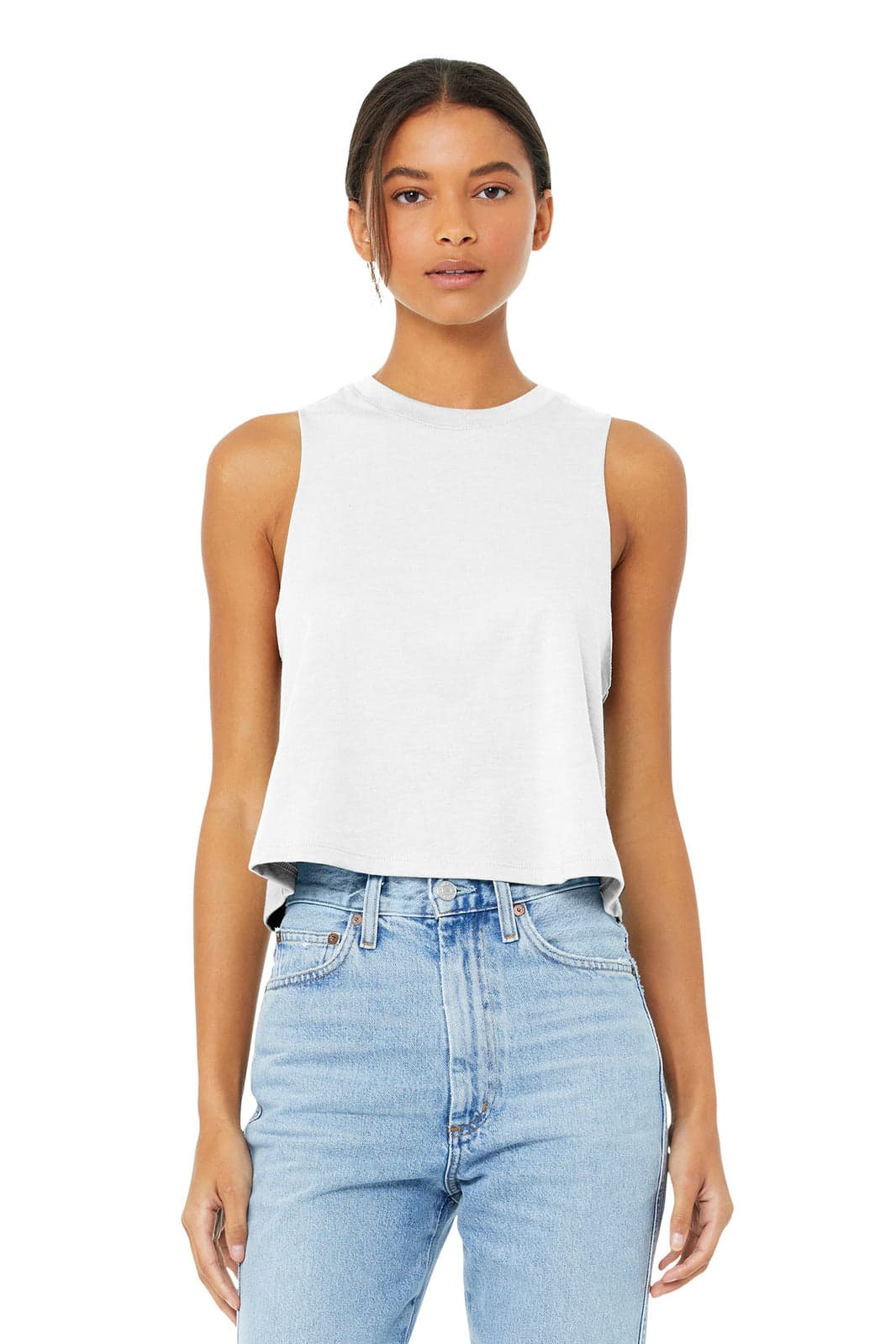 A white women's racerback cropped tank top is displayed on a model, paired with light blue jeans.