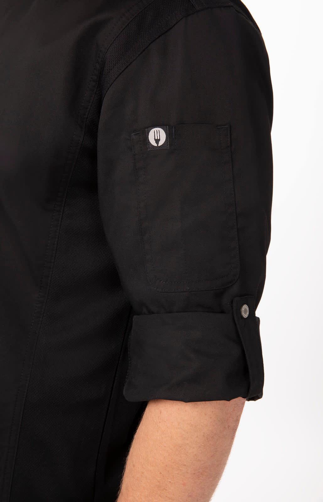 A black chef jacket featuring rolled-up sleeves and a button detail, with a logo on the sleeve.