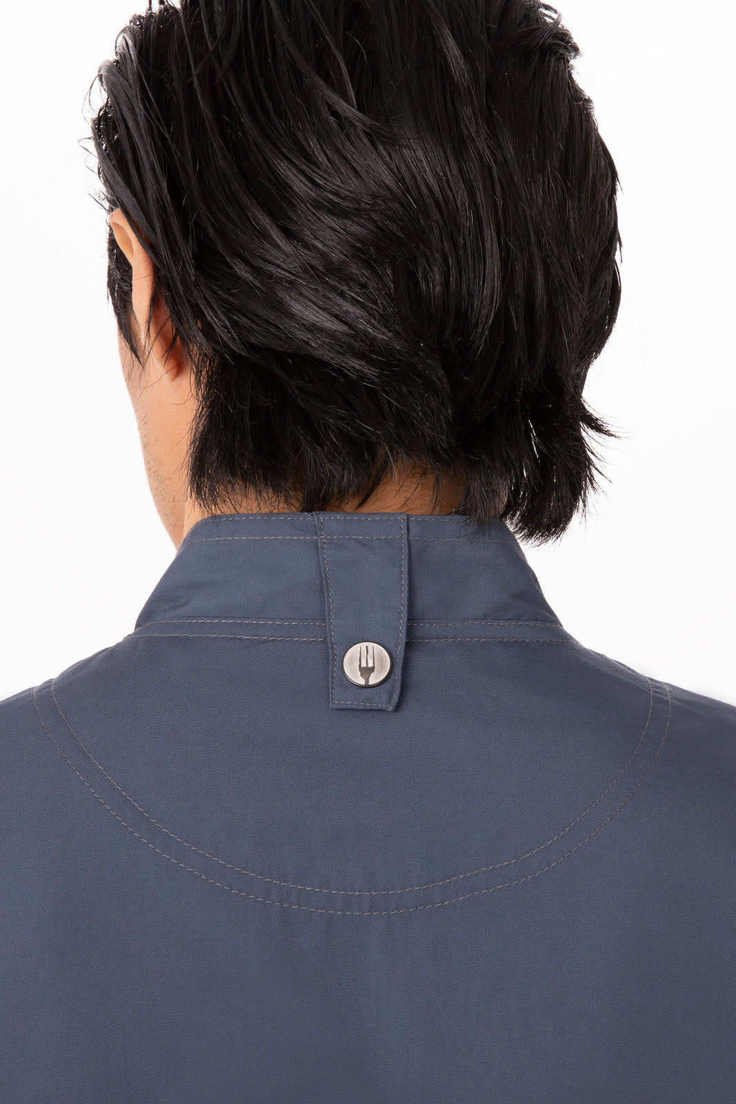 A navy chef jacket with a collar and a button detail at the back, featuring a branding logo.