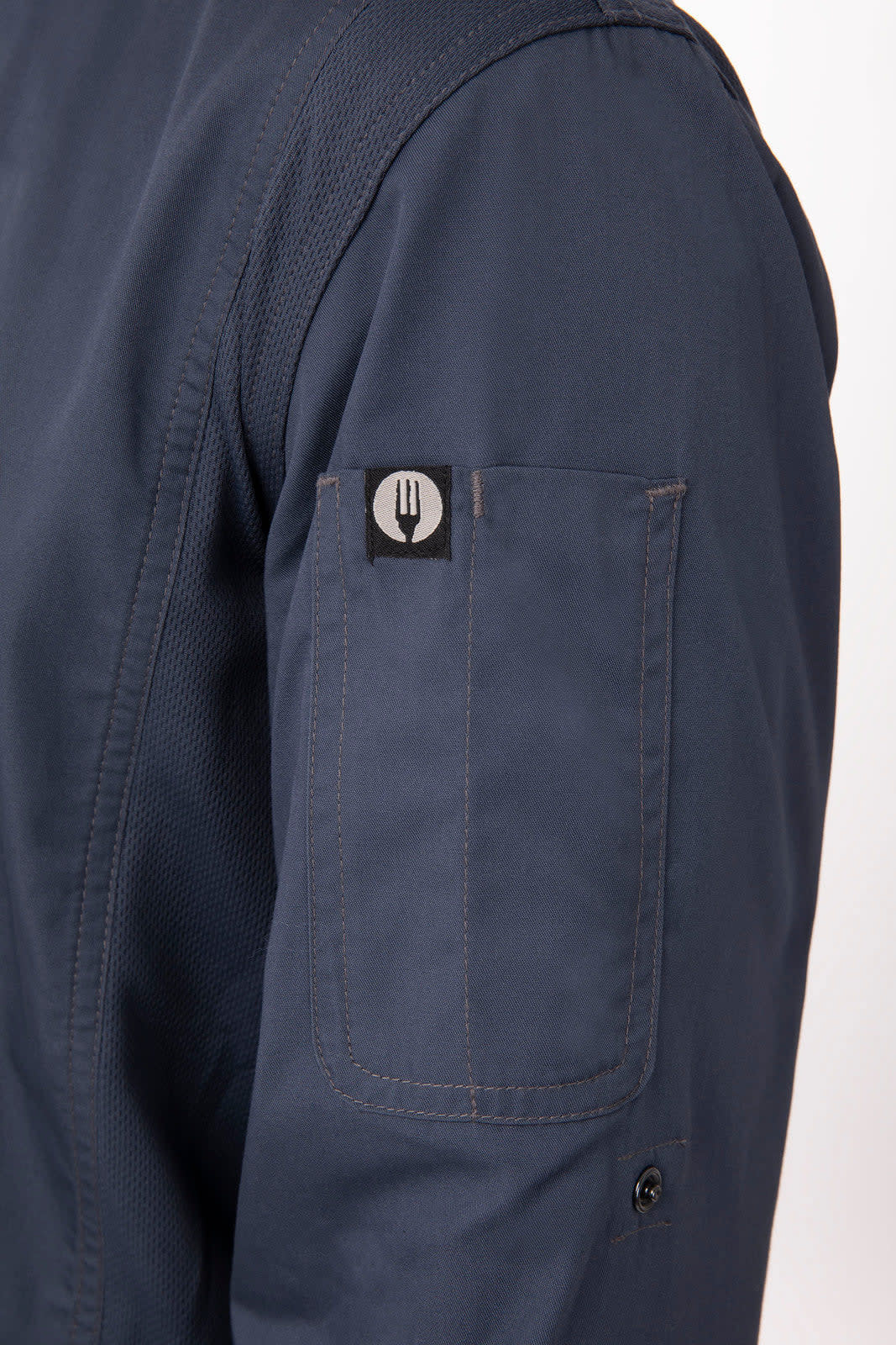 A navy men's chef jacket with a fitted design and a pocket on the sleeve featuring a logo.