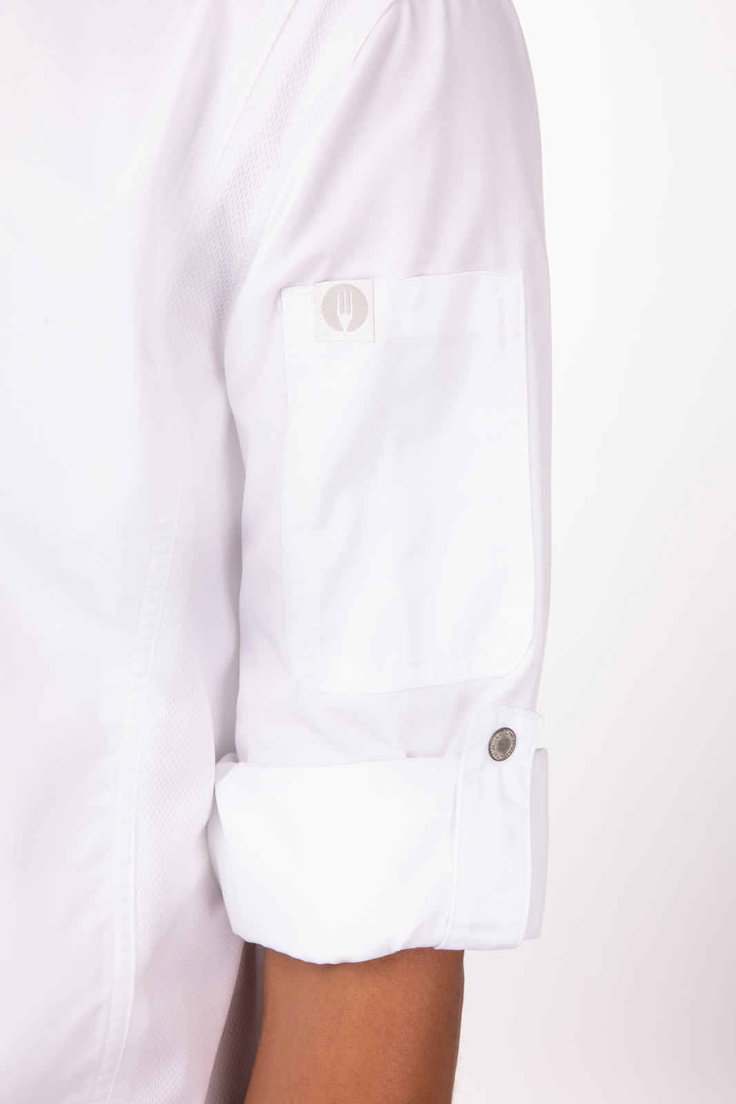 A white chef jacket featuring rolled sleeves and a button detail on the arm, with a logo on the pocket.
