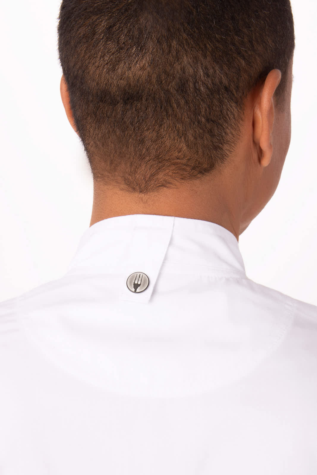 A white chef jacket with a button detail at the back, featuring a logo on the neck.