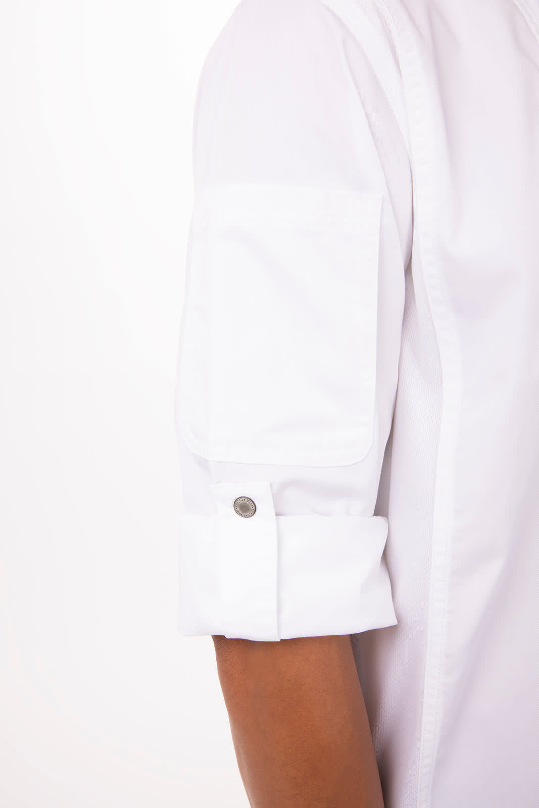 A white chef jacket featuring rolled-up sleeves and a small pocket with a snap button.