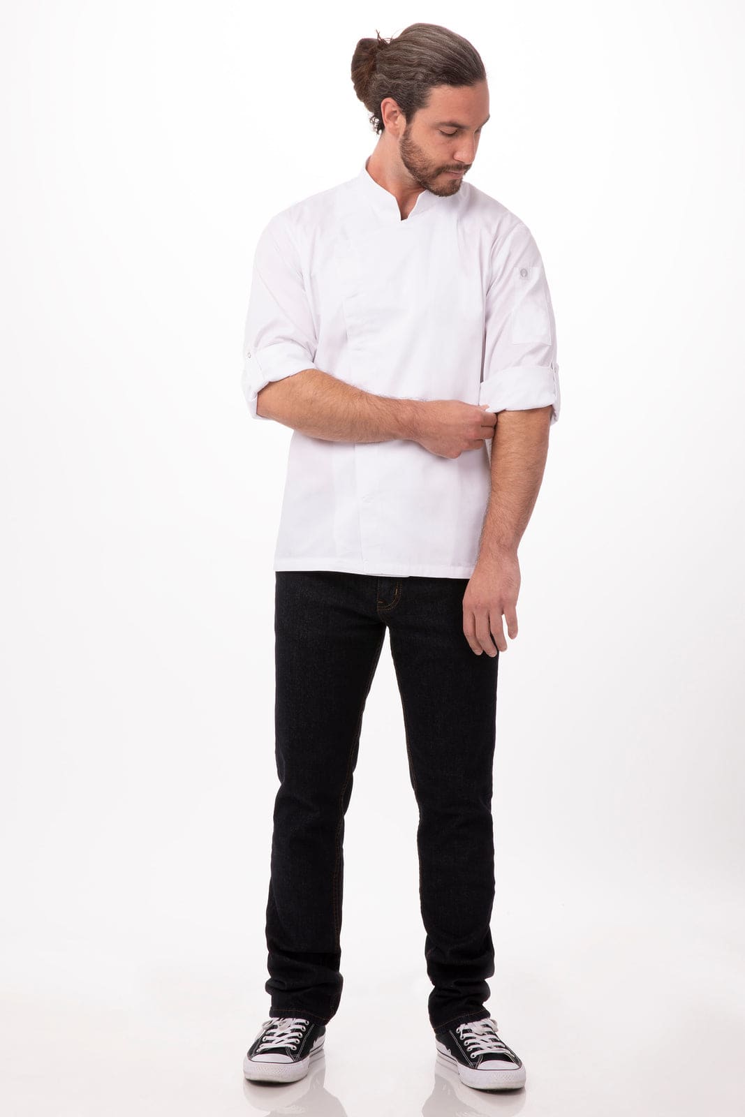 A white men's chef jacket with a mandarin collar, worn by a man standing casually in black jeans and sneakers.