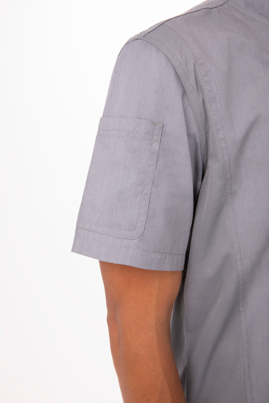 A grey chef jacket with short sleeves, featuring a patch pocket on the left arm. It has a subtle logo on the fabric.