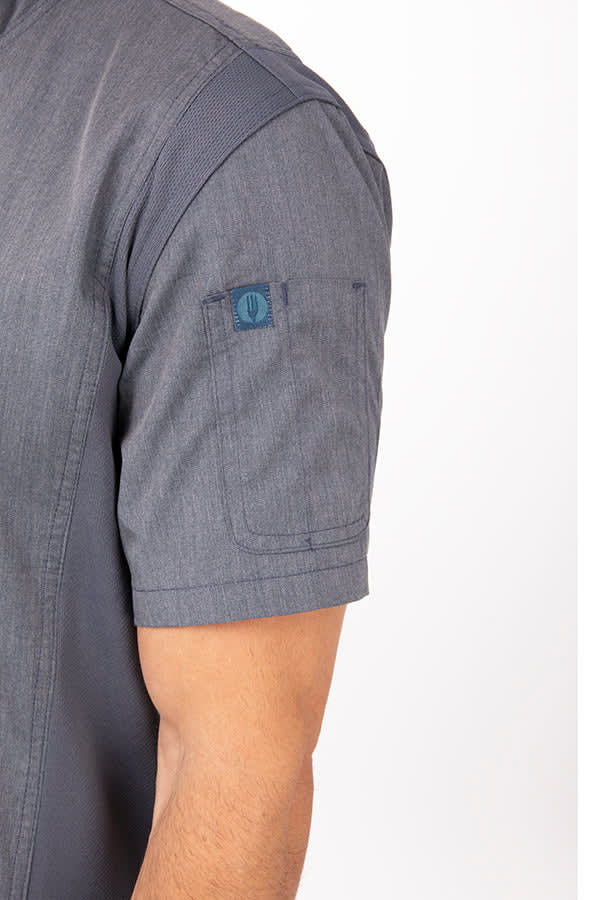 A grey chef jacket featuring short sleeves and a branded logo on the sleeve.
