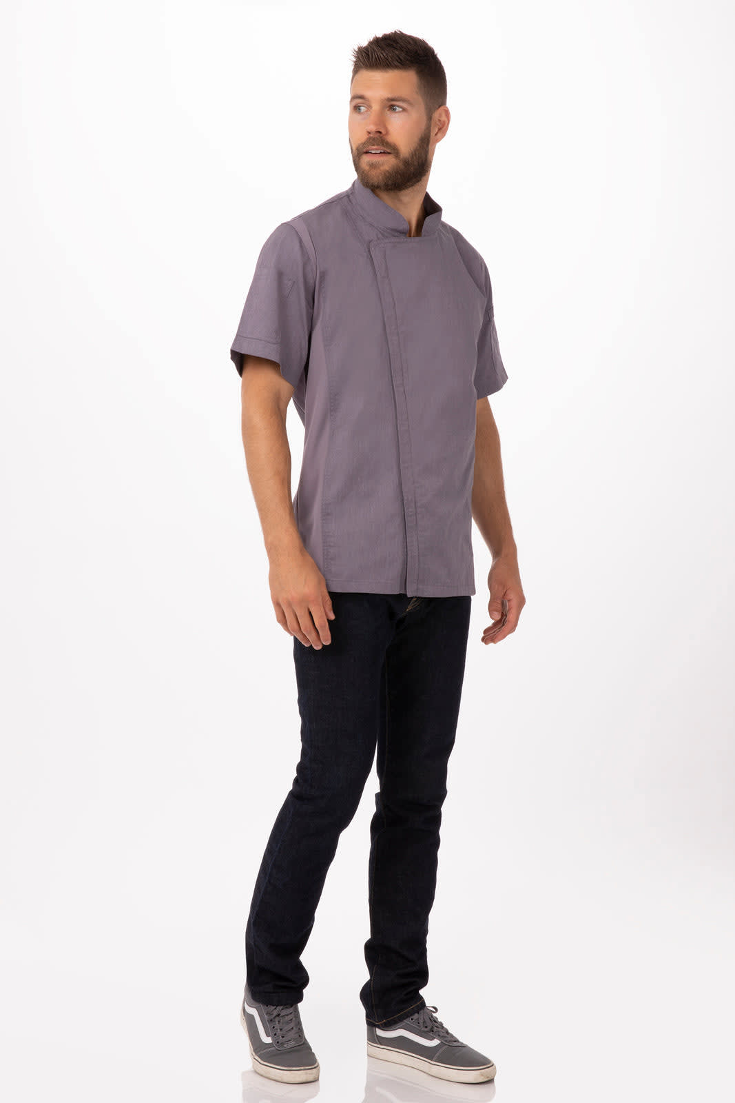 A grey chef jacket with short sleeves, worn by a man standing against a plain background.