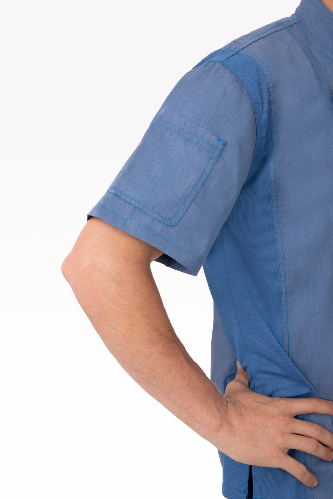 A blue chef jacket featuring short sleeves and a pocket on the shoulder. The jacket has a subtle texture and a fitted design.