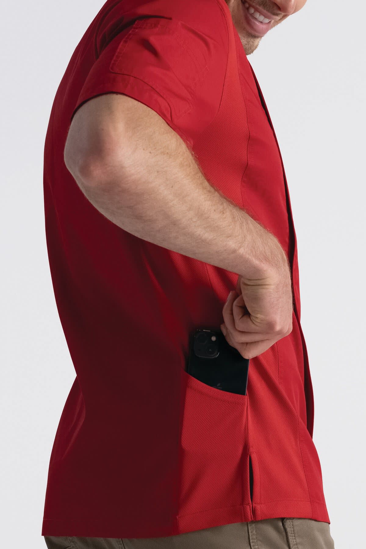 A red men's chef jacket with a pocket, designed for culinary professionals, features branding on the jacket.