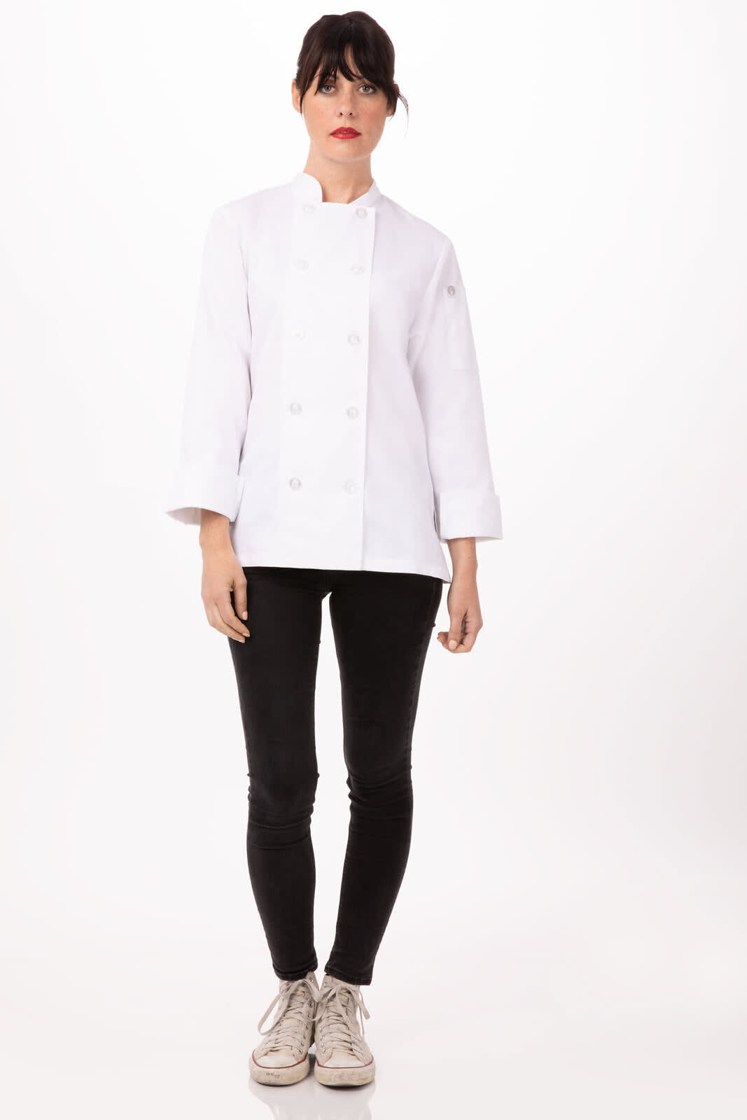 A white women's chef jacket with long sleeves, paired with black pants and sneakers, displayed on a model.