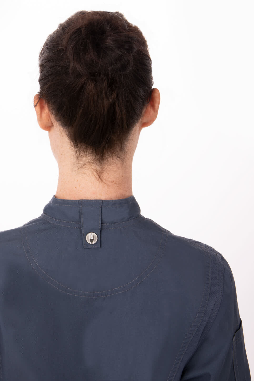 A women's navy chef jacket featuring a stand-up collar and a button at the neck, shown from the back.