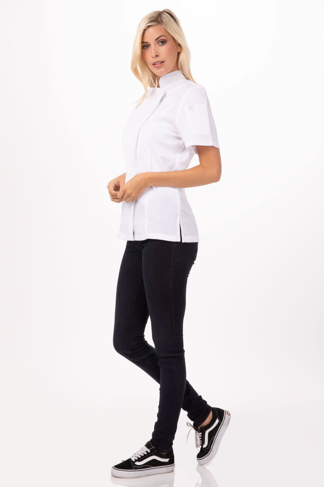A white women's chef jacket with short sleeves, paired with black pants and shoes, featuring a logo.