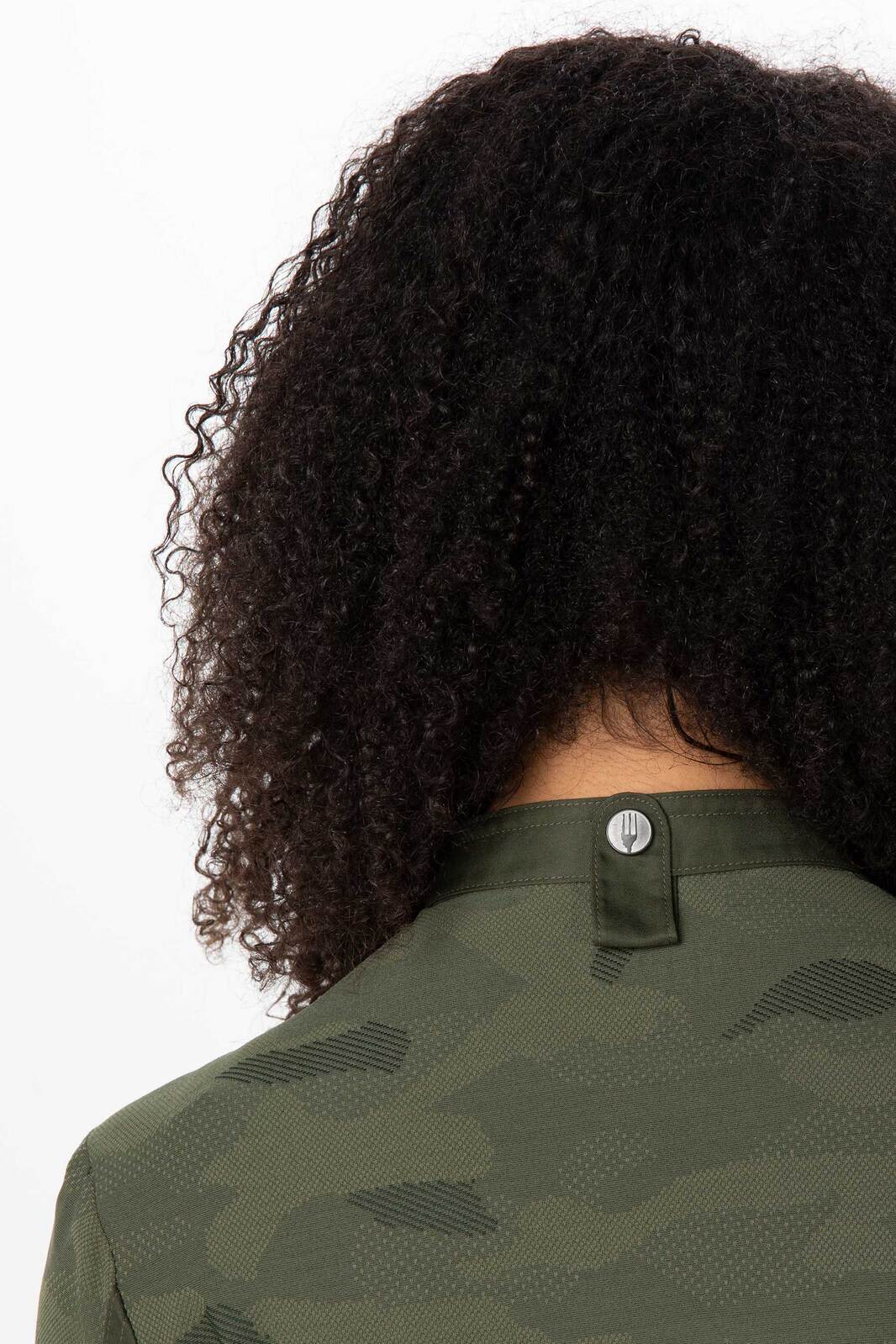 A green women's chef jacket featuring a textured pattern and a button at the back collar.