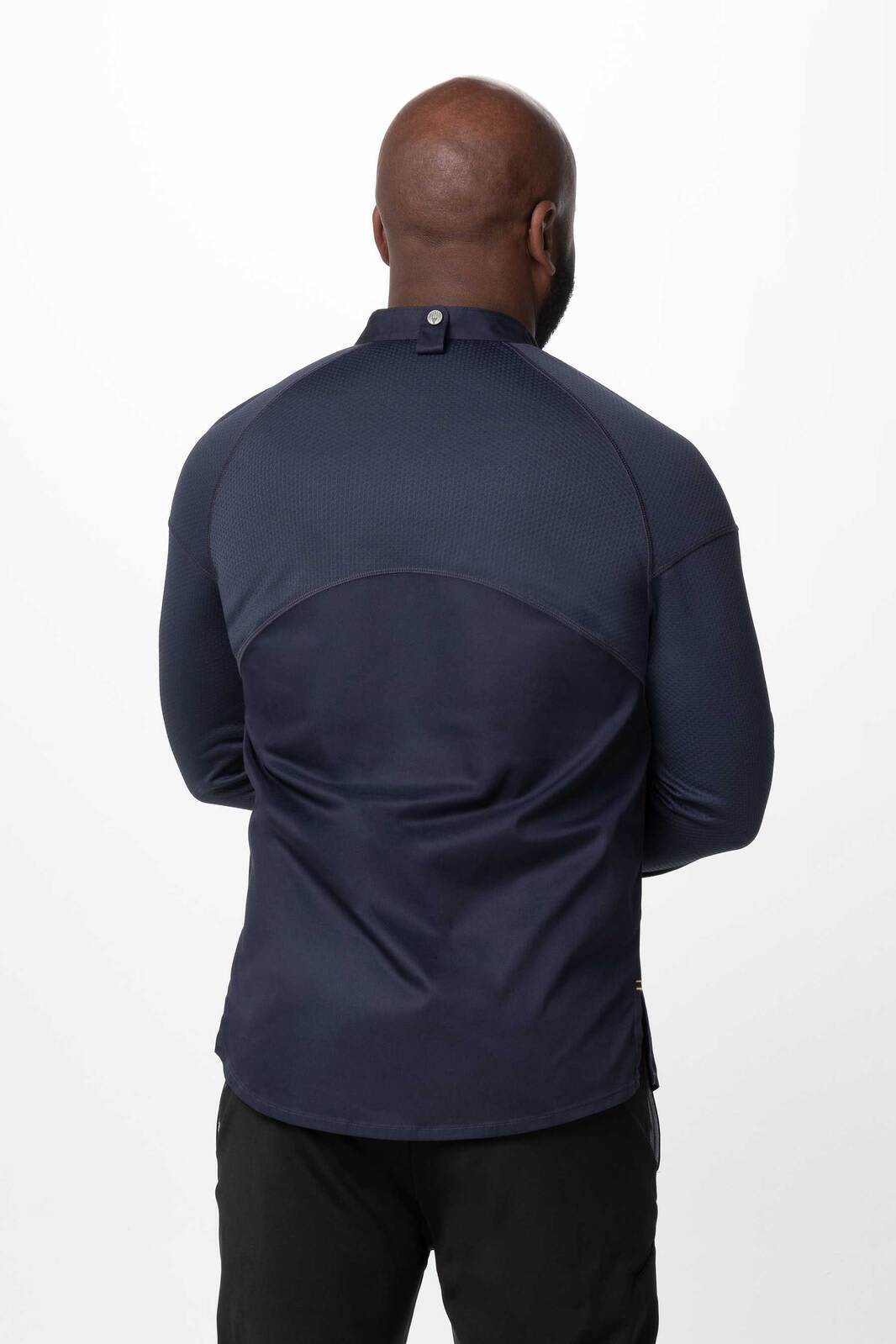 A navy blue men's chef jacket featuring a high collar and button closure at the back. It has a branded logo.