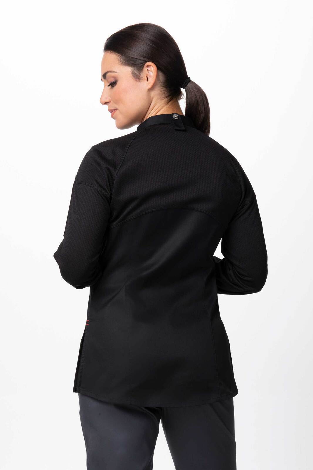 A black women's chef jacket featuring a tailored fit and a back closure, modelled by a woman.