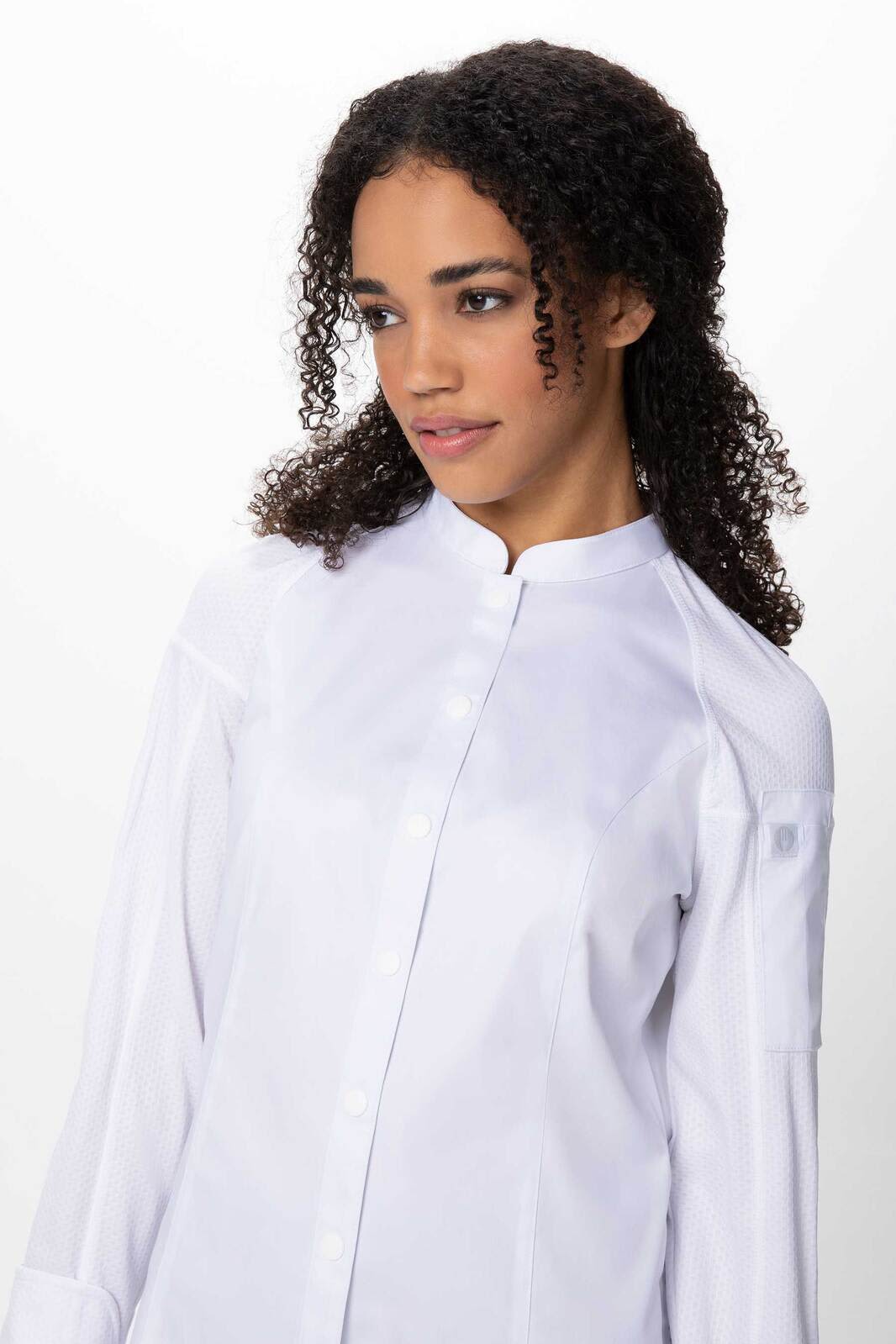 A women's chef jacket in white, featuring a collar and button front, with a model displaying the design.