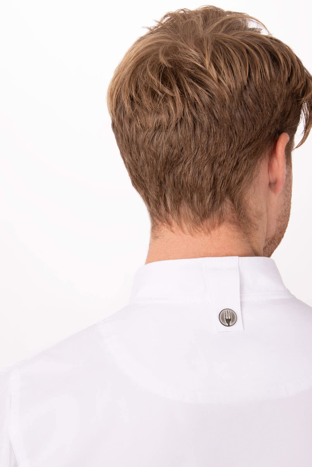 A white chef jacket featuring a stand-up collar and back button detail, modelled from behind.