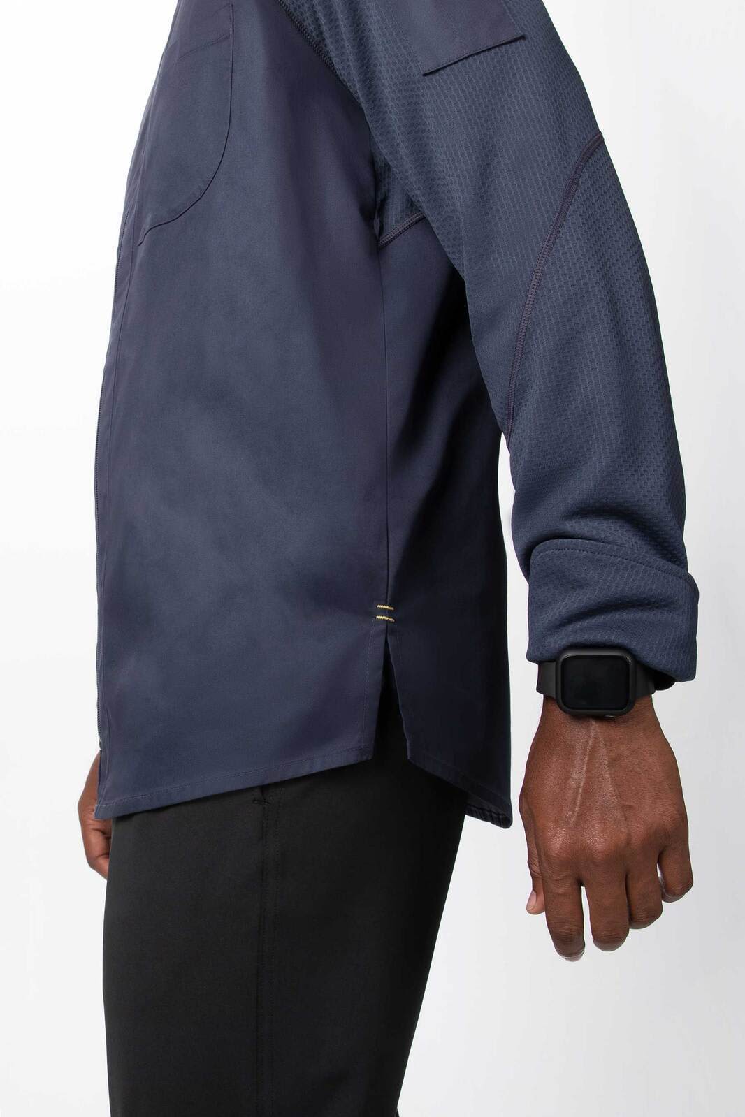 A navy men's chef jacket with long sleeves and a side slit, featuring a small logo on the sleeve.