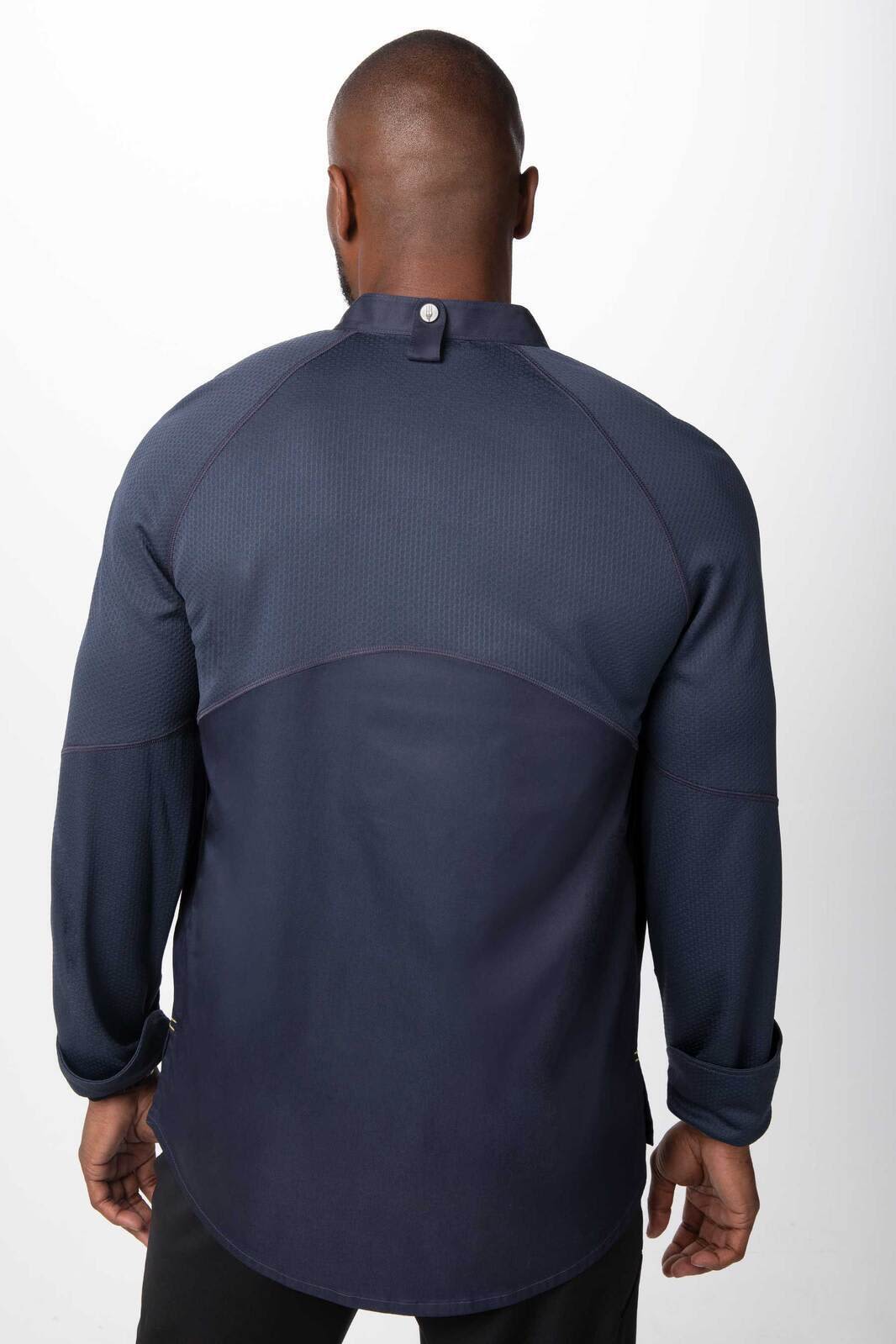 A men's chef jacket in navy blue with a buttoned collar and long sleeves, featuring a logo on the back.