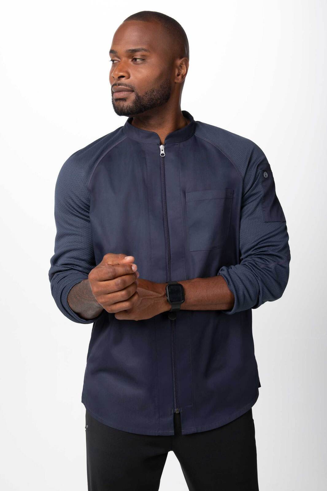A navy men's chef jacket with a zip front, long sleeves, and a pocket, featuring a logo on the sleeve.