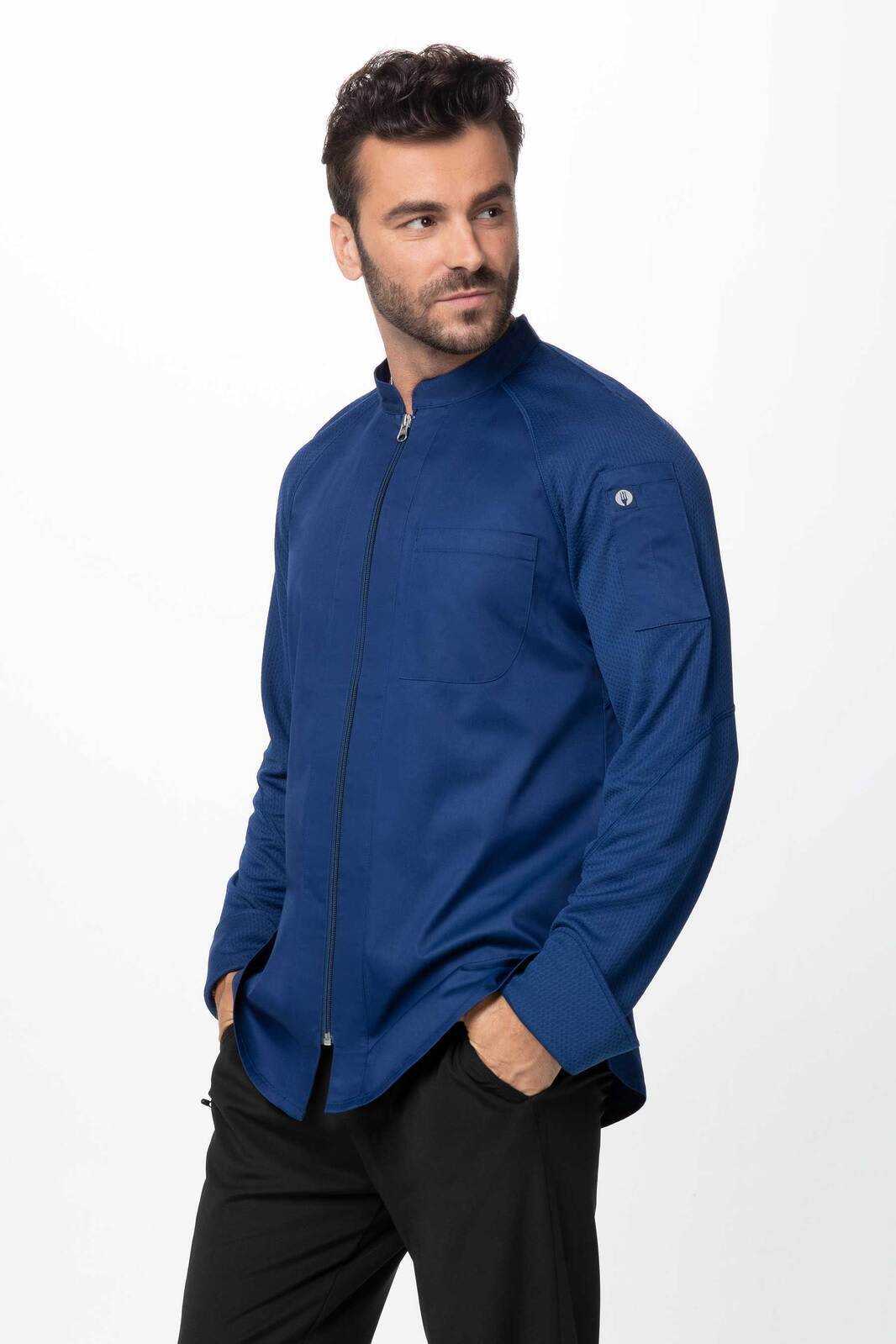 A men's chef jacket in a deep navy blue with a structured collar and a logo on the sleeve.