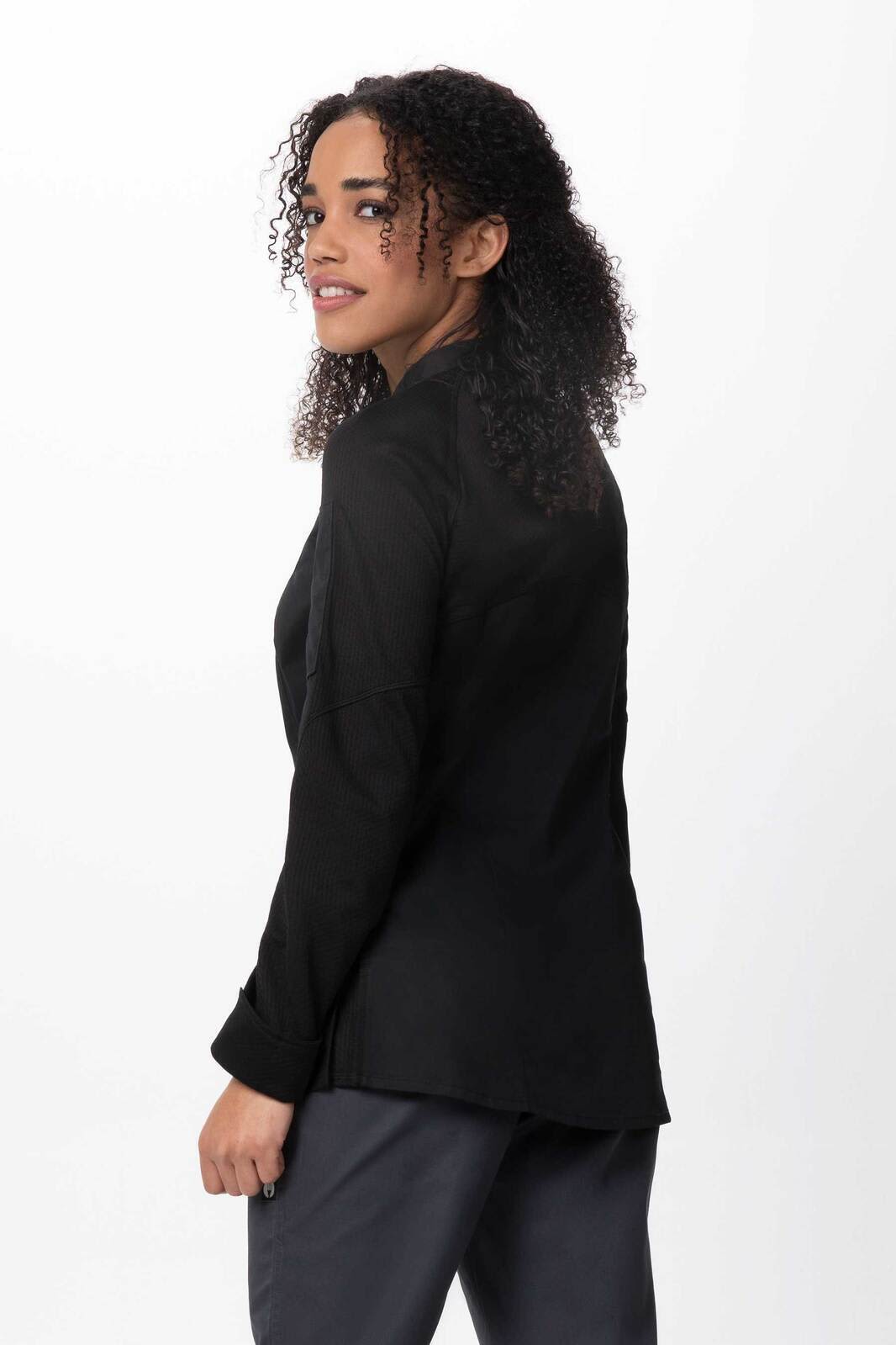 A black women's chef jacket features a tailored fit and a stylish design. The model displays the back view.
