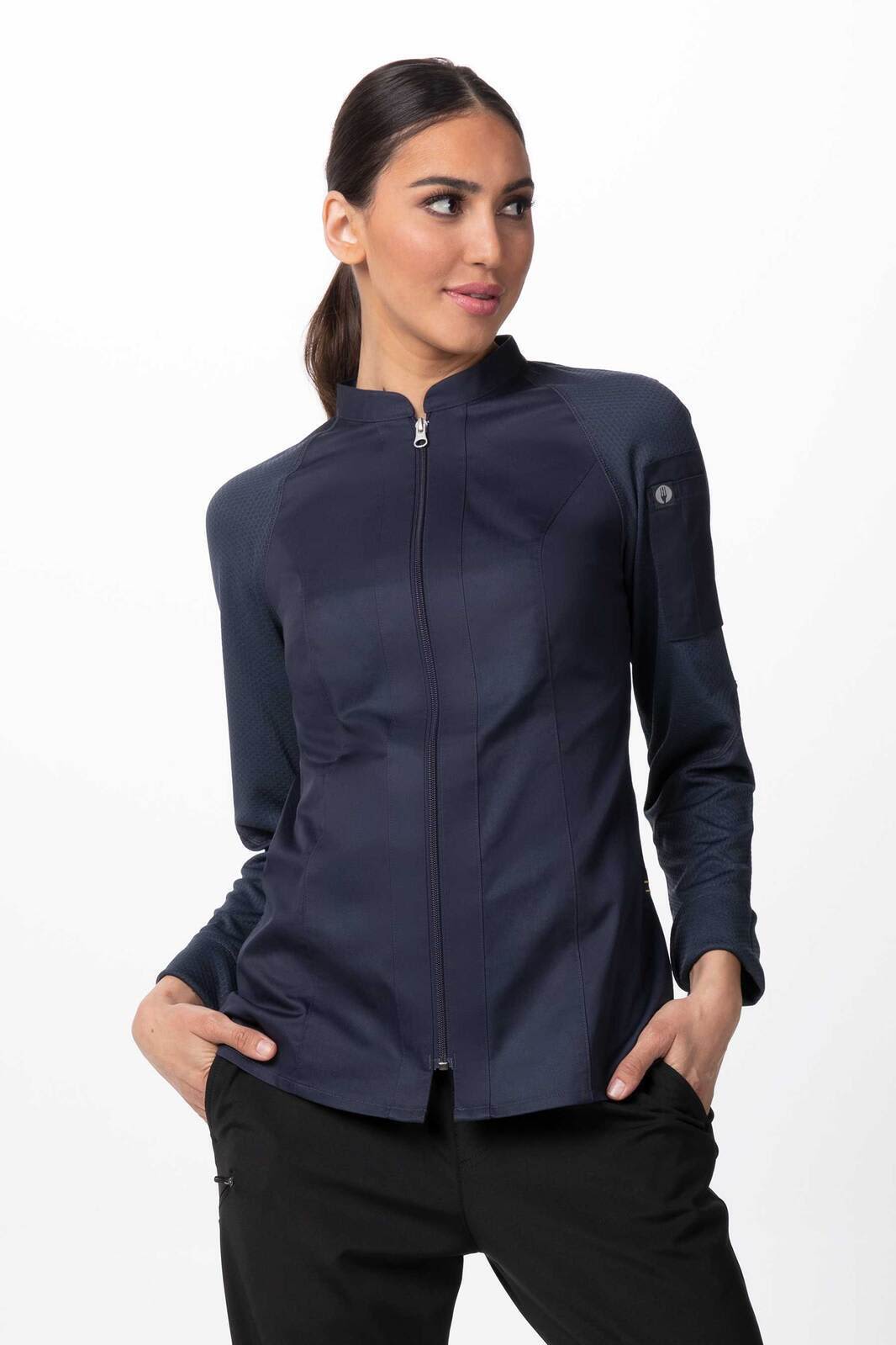 A navy women's chef jacket with a zip front and long sleeves, featuring a logo on one sleeve.