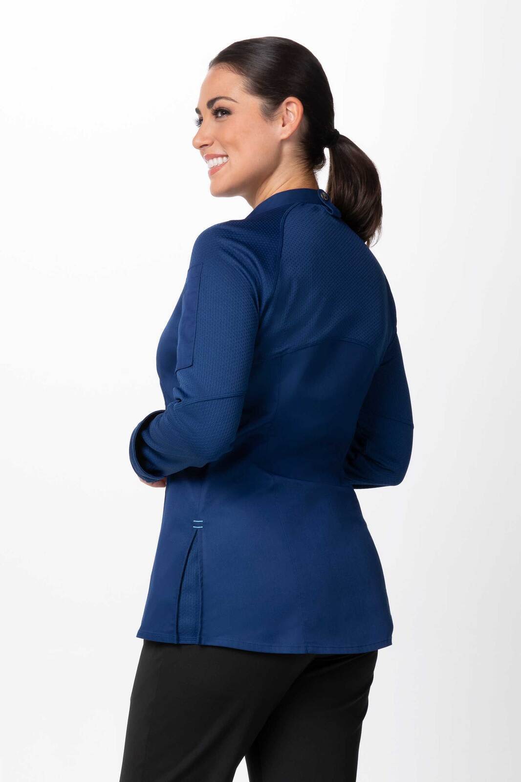 A navy women's chef jacket with a fitted design and subtle logo on the back.