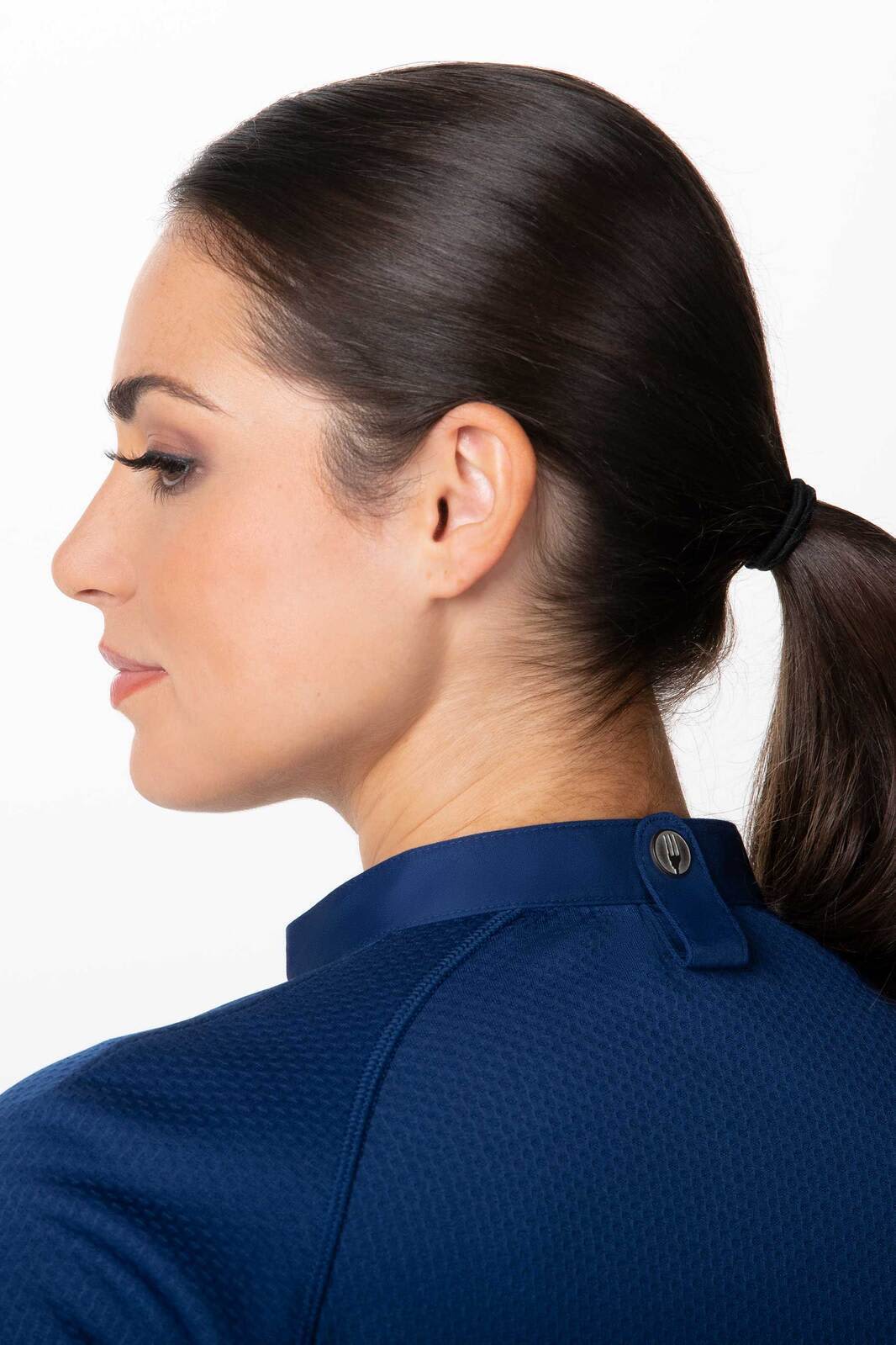 A navy women's chef jacket featuring a stylish collar and a back button detail.