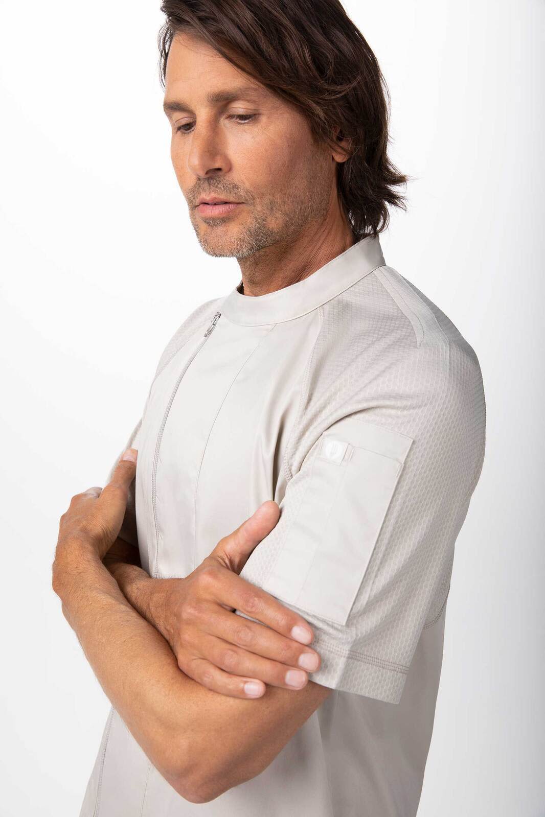 A men's chef jacket in a light grey colour, featuring a short sleeve design and a logo on the sleeve.