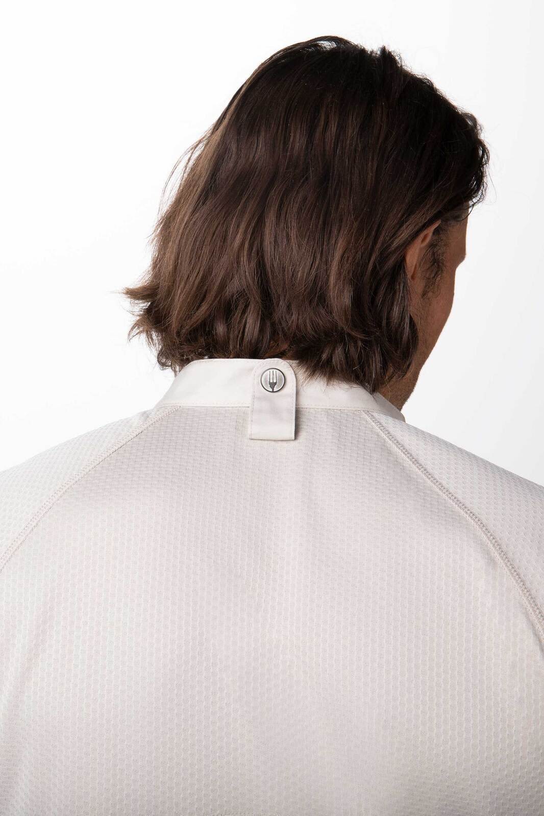 A white men's chef jacket with a textured fabric, featuring a small logo at the collar and a classic design.