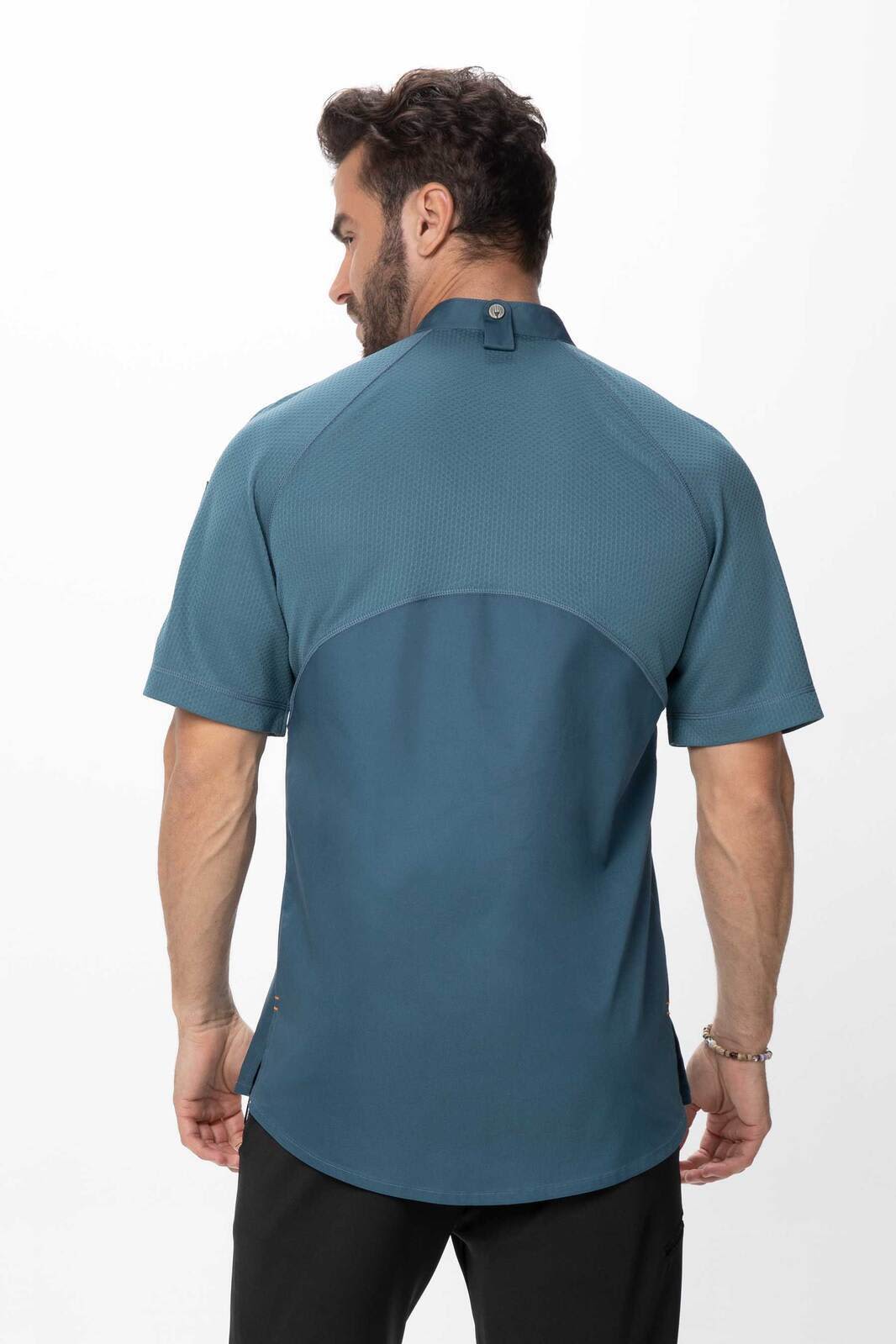 A men's chef jacket in teal, featuring a short-sleeve design and a back button detail. Includes branding on the fabric.
