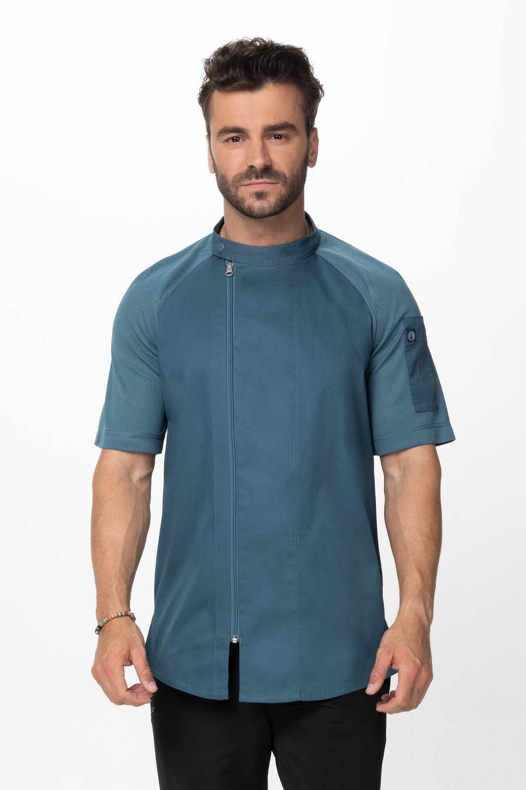 A men's chef jacket in teal with short sleeves, featuring a sleek design and a logo on the sleeve.