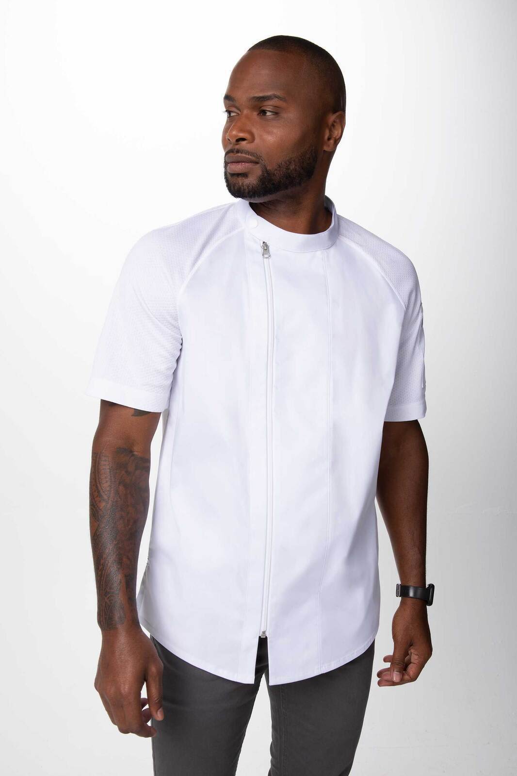 A men's chef jacket in white, featuring short sleeves and a front zip. It has a logo on the side.