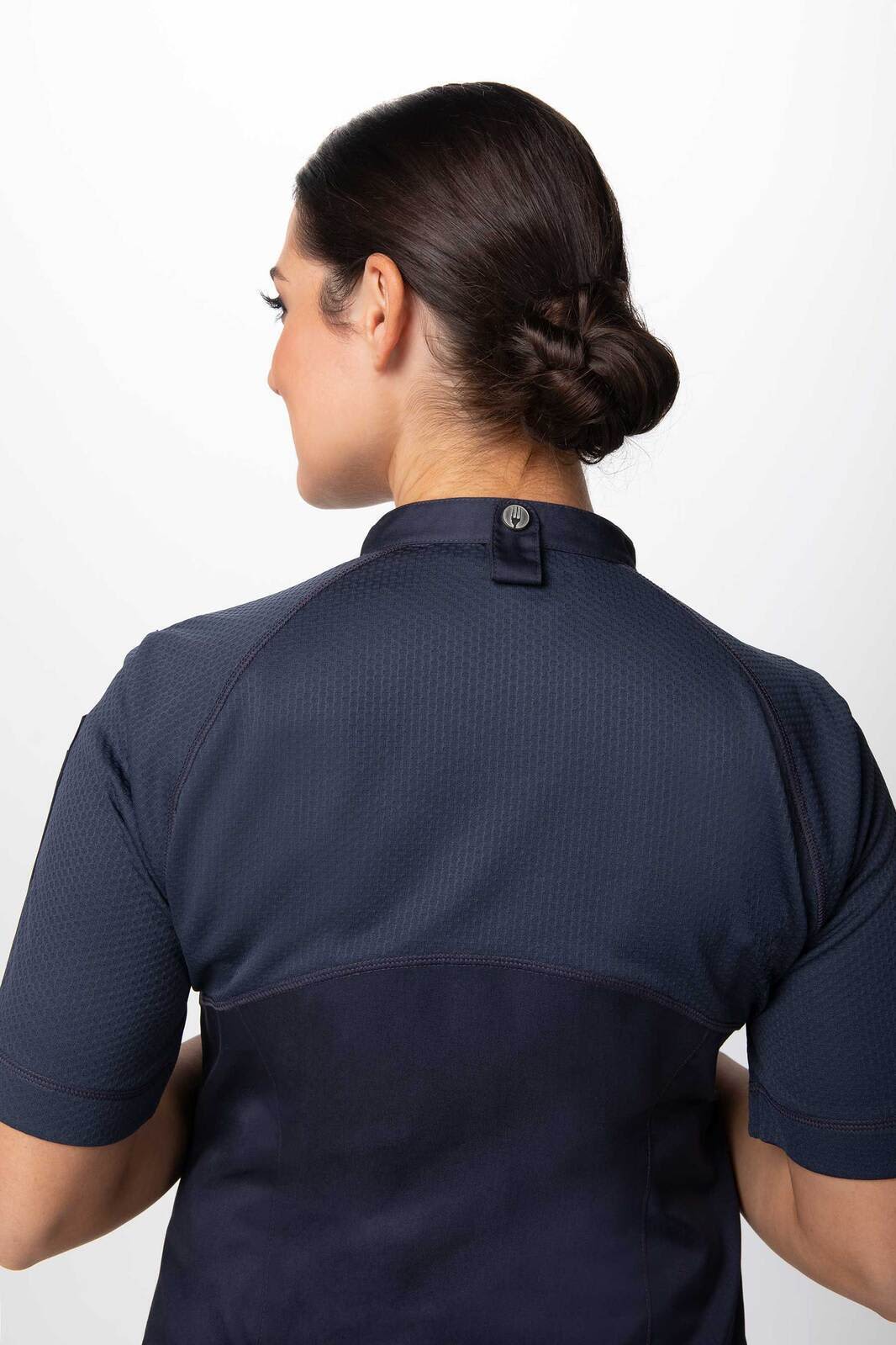 A navy blue women's chef jacket with a button closure at the back and short sleeves. Features a subtle logo.