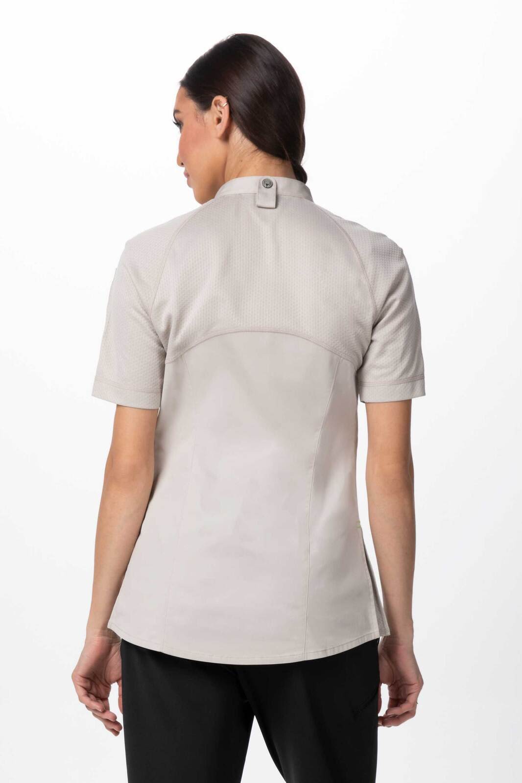 A women's chef jacket in light grey, featuring short sleeves and a back button closure, with a logo present.