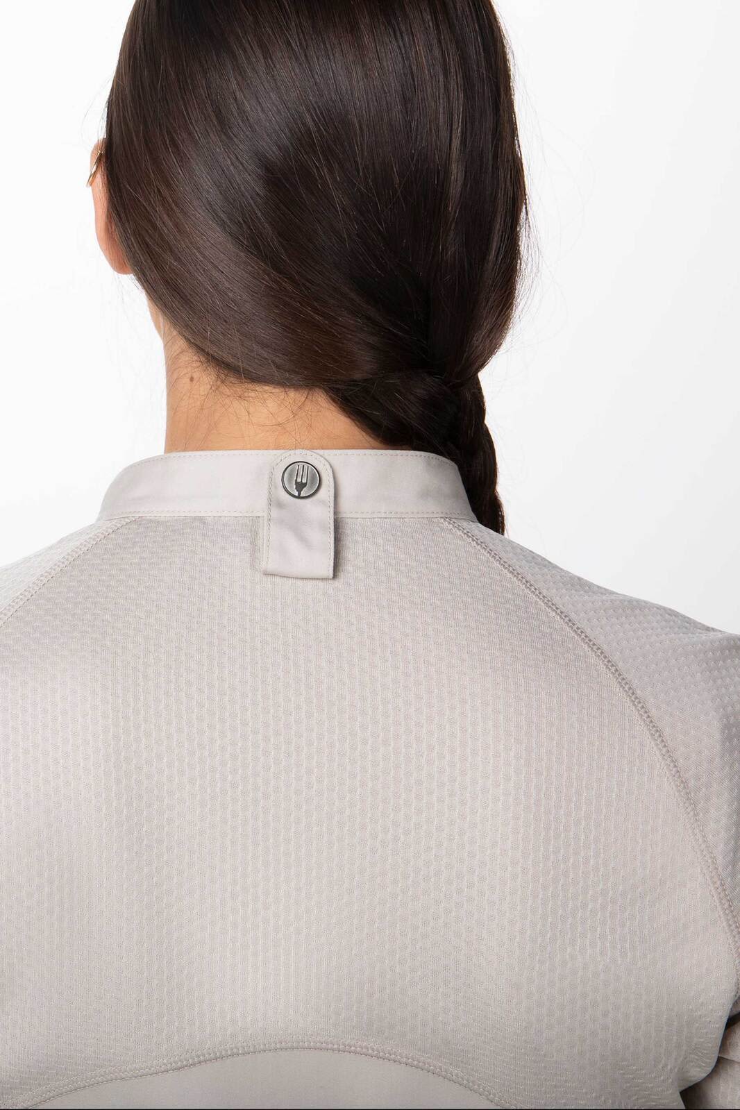 A women's chef jacket in light grey, featuring a small logo on the back and a simple design.