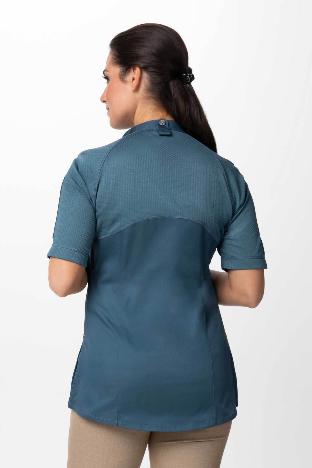 A women's chef jacket in teal, featuring short sleeves and a fitted design, displayed from the back.