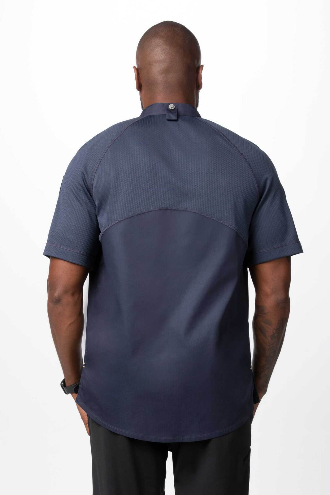 A men's chef jacket in navy blue, featuring short sleeves and a back button closure, with a logo present.