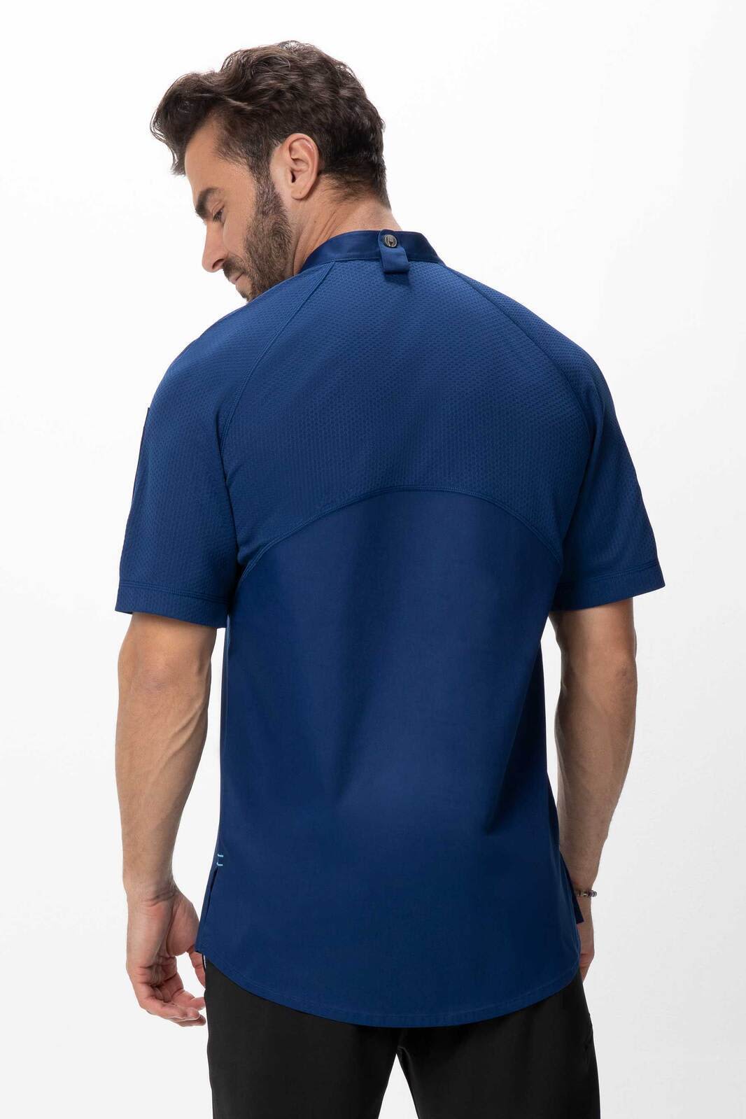 A men's chef jacket in navy blue, featuring a short-sleeve design and a back button detail. Includes a logo.