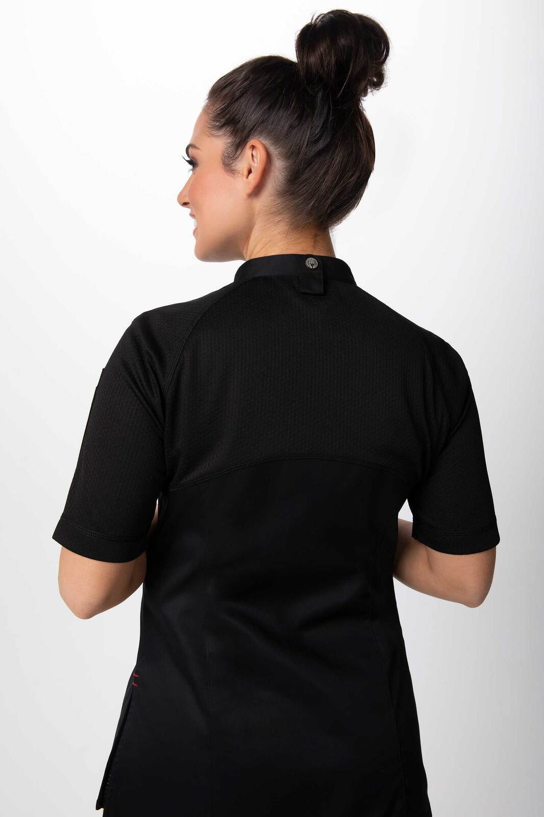A women's chef jacket in black, featuring a back view with short sleeves and a collar. It includes a logo.
