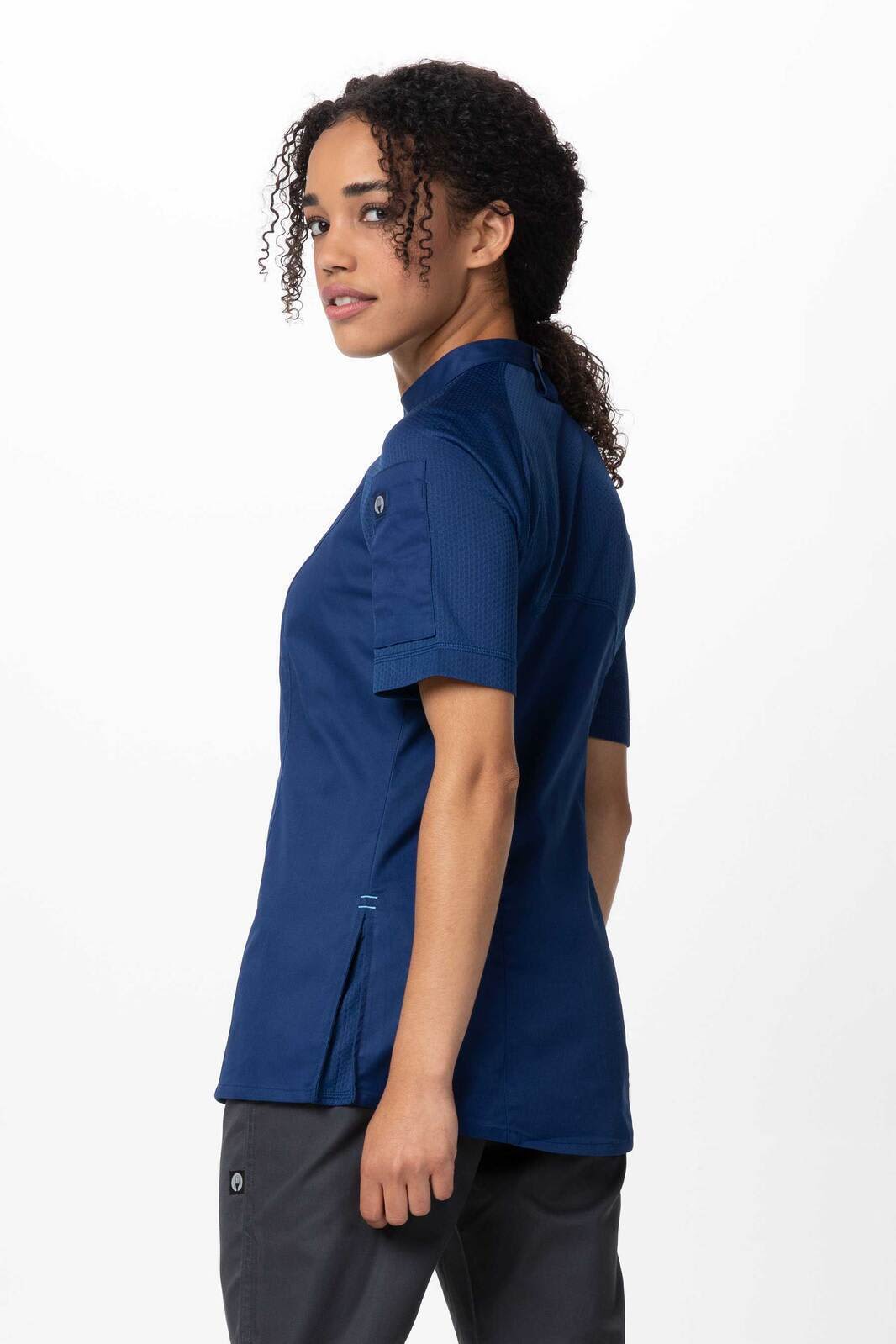 A women's chef jacket in navy blue, featuring short sleeves and a tailored fit, with a logo visible.