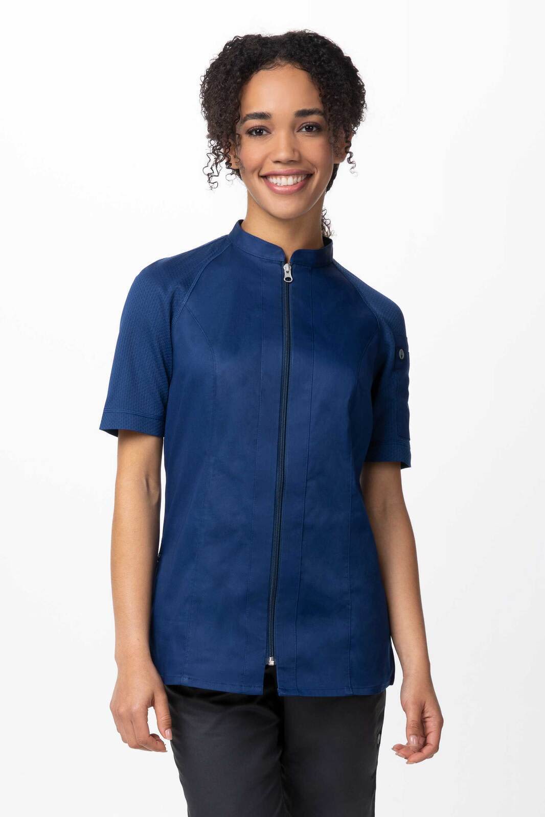 A navy blue women's chef jacket with a zip front and short sleeves, featuring a logo on the sleeve.