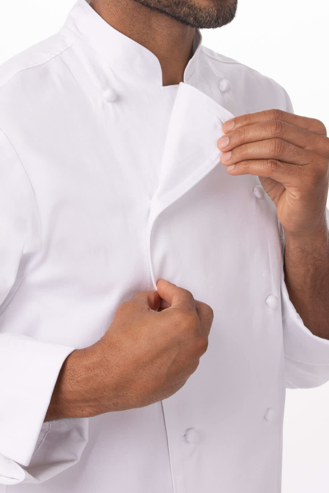 A white chef jacket featuring a stand-up collar and double-breasted design, with a hand adjusting the collar.
