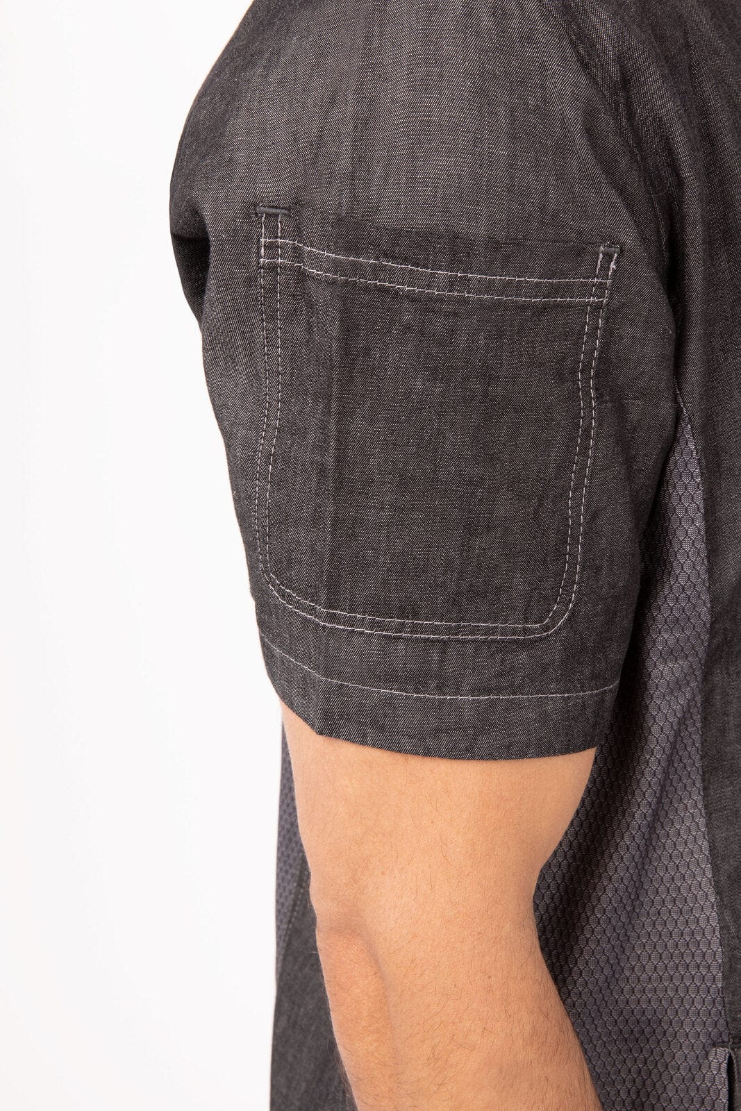 A grey men's executive chef jacket featuring short sleeves and a side pocket. It has a logo on the fabric.