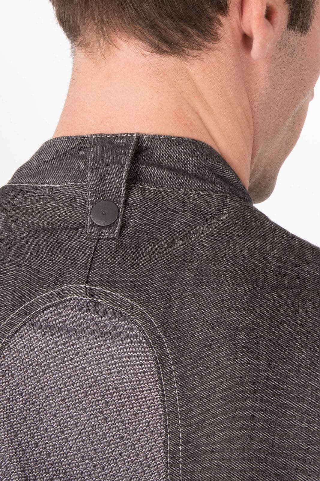 A men's executive chef jacket in charcoal grey, featuring a button closure and mesh detail on the back.