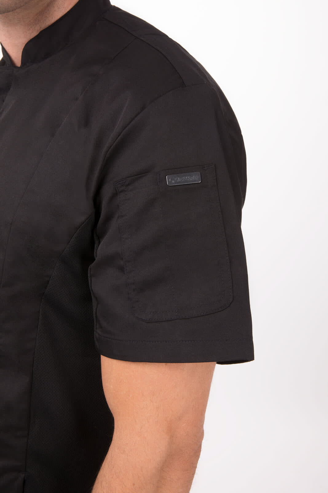 A black chef jacket featuring short sleeves and a side pocket, with a logo on the sleeve.