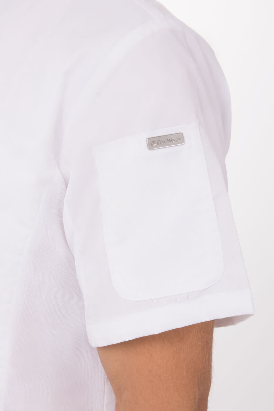 A white chef jacket features short sleeves and a pocket on the left arm, with a logo on the sleeve.