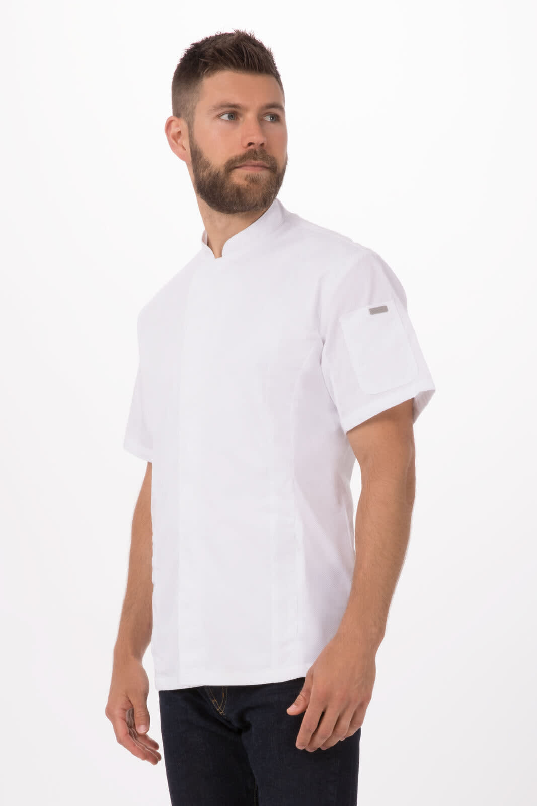 A white chef jacket featuring short sleeves and a stand-up collar, worn by a man. The jacket has a logo on it.